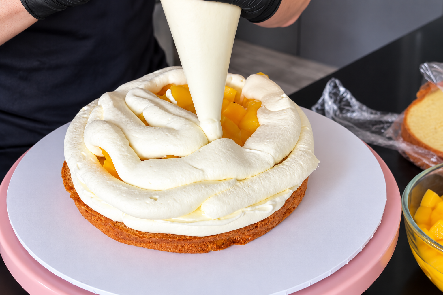Covering the mango filling with cream